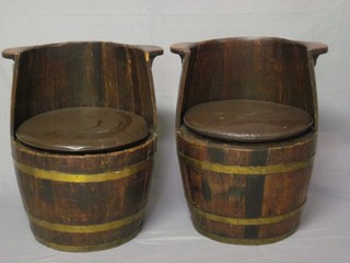 A pair of oak coopered seats in the form of barrels