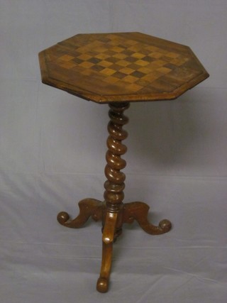 A Victorian octagonal inlaid mahogany games table, the top  inlaid a chessboard and raised on spiral turned column and tripod  base 19"
