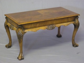 A Queen Anne style rectangular walnut coffee table, raised on carved cabriole supports 31"