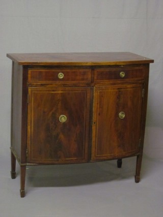 A 19th Century mahogany bow front side cabinet, fitted 2  drawers above a double cupboard, raised on square tapering  supports ending in spade feet 36"