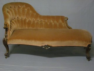A Victorian rosewood show frame chaise longue upholstered in  buttoned back pink Dralon, raised on cabriole supports 67" ILLUSTRATED 