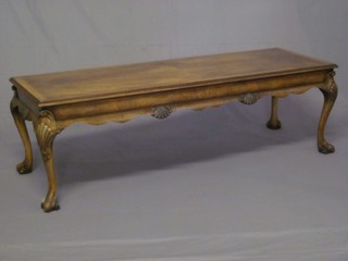 A rectangular Queen Anne style walnut coffee table, raised on  carved cabriole supports 54"