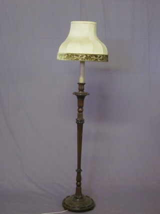 A turned and fluted standard lamp