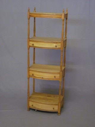 A Georgian style bleached mahogany 4 tier bow front what-not fitted 3 drawers and raised on turned and block supports 16"