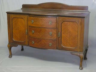 An Edwardian bow front sideboard with raised back, fitted 3  drawers flanked by cupboards, raised on cabriole supports 60"