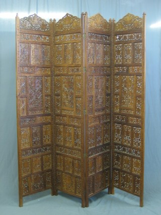 A Burmese pierced and carved hardwood 4 fold screen