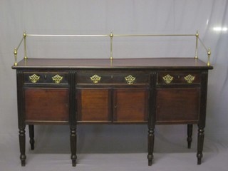 A 19th Century style mahogany sideboard with raised rail back,  fittd 1 long drawer flanked by 2 short drawers above double  cupboards, raised on turned and reeded supports 66"