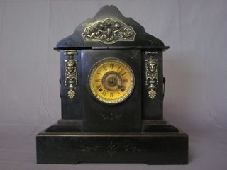 An American 8 day striking mantel clock with gilt dial and Arabic numerals, contained in a black marble architectural case  19"