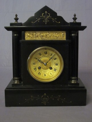 A Victorian 8 day striking mantel clock with a gilt dial and Roman numerals contained in a black marble case by Benzie of  Cowes