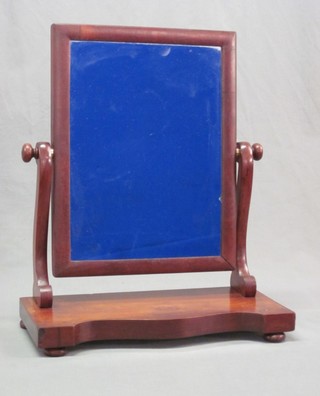 A 19th Century rectangular plate dressing table mirror contained  in a mahogany swing frame 17"