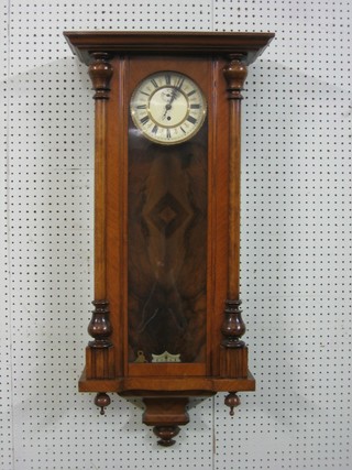A Vienna style regulator with 6 1/2" porcelain dial with Roman numerals and minute indicator, contained in a walnut case  ILLUSTRATED