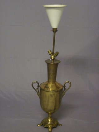 A brass table lamp converted from a twin handled tea urn 24"