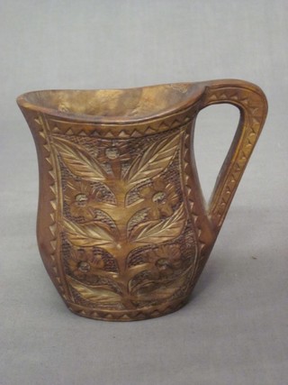 A carved hardwood jug 4"