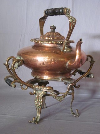 A 19th Century copper spirit kettle raised on a stand
