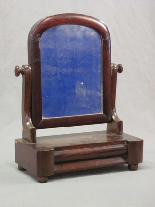 A 19th Century arched plate dressing table mirror contained in a mahogany swing frame, the base fitted a drawer 14"