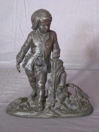 A 19th Century spelter figure of a standing child 9"