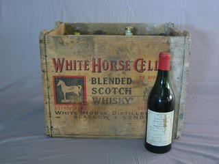 A wooden crate containing a 1970 bottle of Pies Porter Michelsberg, 5 bottles of 1971 Puligny Montrachet, 2 bottles of  1975 Cotes du Rhone and 4 other bottles