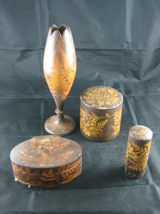 A treen vase 8", 2 cylindrical treen jar and covers and an oval box all with fern decoration
