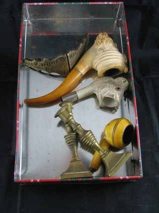 A Meerschaum pipe in the form of a Turk's head, do. Buffalo, 1  other pipe, a pair of miniature candlesticks and a metal boss  marked J Hulford & Sons