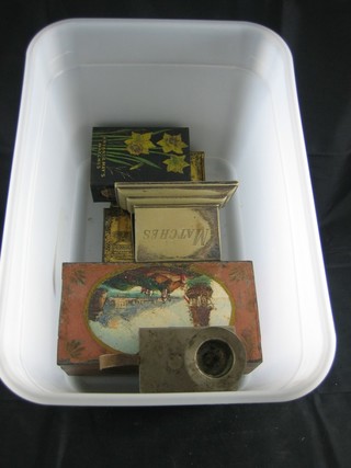 A painted metal match box slip 5", a match box slip  incorporating a chamber stick 2" and 4 other match box slips