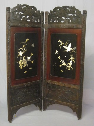 An Oriental carved and lacquered 2 fold screen inlaid with ivory  birds amidst branches