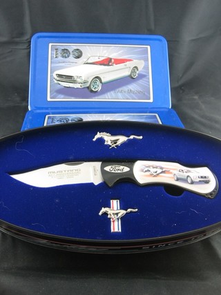 A Mustang Action Racing collector's folding knife, a Mustang  40th Anniversary folding knife, a limited edition model of a 1964  Mustang and a 1965 Thunderbird, together with 2 John Force  model Mustangs ..a401