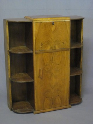An Art Deco figured walnut students bureau bookcase, the centre section with fall front revealing a fitted interior above cupboard  flanked by a pair of bookcases 37"