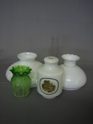 A collection of various white glass oil lamp shades and clear  glass chimneys