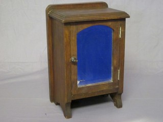 A Victorian mahogany table top cabinet enclosed by an arched bevelled plate panelled door 10"