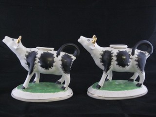 A pair of Staffordshire cow creamers 4"