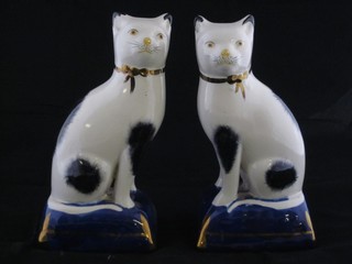 A pair of Staffordshire figures of seated cats 7"