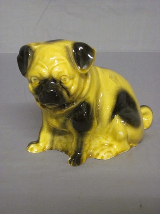 A 19th Century pottery figure of a seated Pug 6"