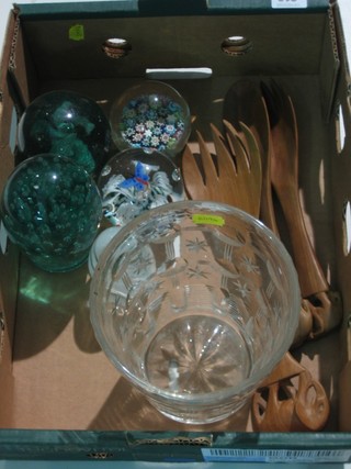 A circular cut glass vase 8", a small collection of paperweights  and 3 carved African wooden salad servers