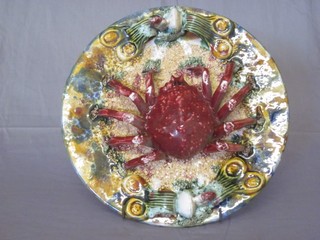 A Continental Majolica circular plate decorated a crab 10"