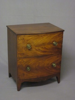 A Georgian mahogany bow front commode in the form of a 2  drawer chest with hinged lid, raised on bracket feet 24"