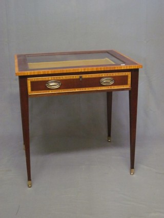A rectangular inlaid mahogany bijouterie table, fitted a drawer and raised on square tapering supports ending in brass caps and  castors 29"