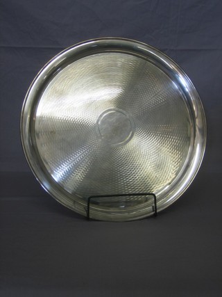 A circular silver plated salver with engine turned decoration 16"