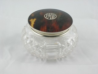 An Art Deco circular cut glass dressing table jar with  tortoiseshell and silver mounted lid, marks rubbed 4"
