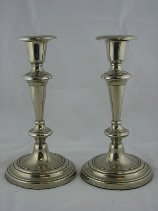 A pair of silver plated candlesticks 9" with detachable sconces
