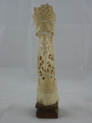 A carved section of ivory tusk, carved a figure of a lady 8"