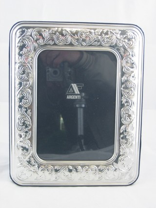 A modern silver easel photograph frame 10" x 7 1/2"