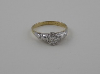 An 18ct yellow gold and platinum dress ring set a circular cut  diamond
