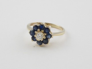 A 14ct yellow gold cluster dress ring set sapphires ..g651