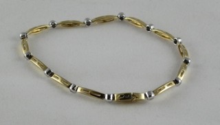 An 18ct gold bracelet interspersed diamonds