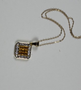 An 18ct yellow gold pendant set diamonds and a citrene, hung on  a fine gold chain