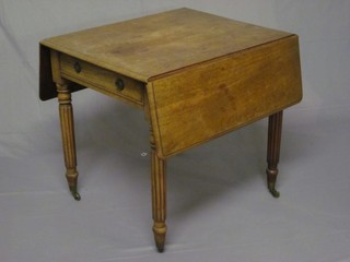 A 19th Century bleached mahogany Pembroke dining table, fitted  a frieze drawer and raised on turned and reeded supports 31"