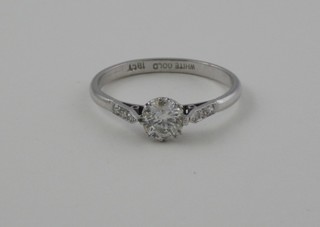 A lady's 18ct white gold dress ring set a solitaire diamond and with diamonds to the shoulders approx 0.80ct