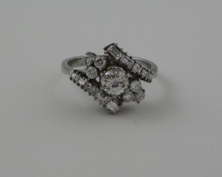 A lady's 18ct white gold cross-over ring set numerous diamonds