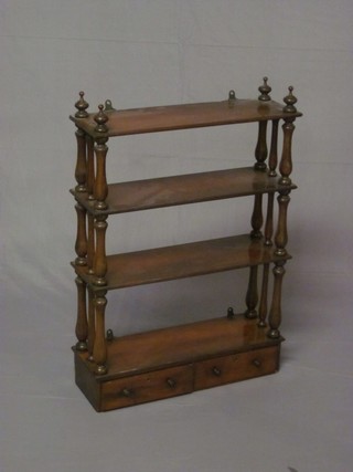 A Victorian rectangular mahogany 4 tier what-not, the base fitted  2 drawers and raised on turned supports 22"