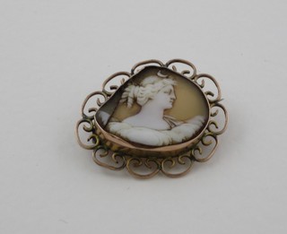 A shell carved cameo contained in a gilt metal brooch